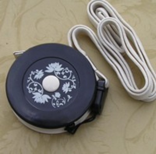 Black cream measuring tape 2.JPG